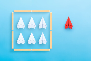 Think outside the box, different thinking, Business for solution concept with paper planes on blue background