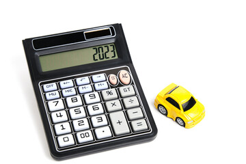 Toy car and calculator white background.Concept buying car.