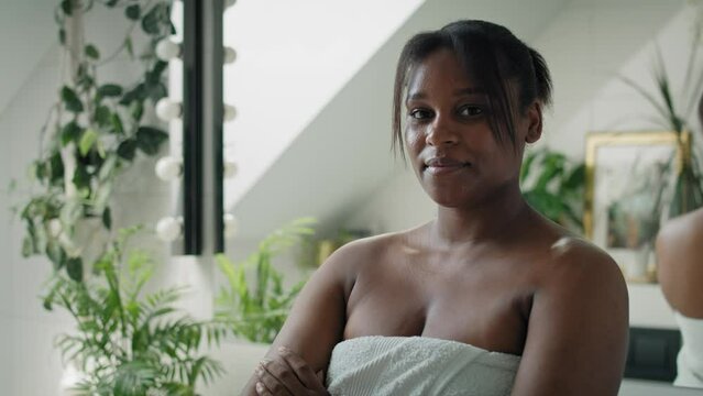 Portrait of young African-American woman in the bathroom. Shot with RED helium camera in 8K.