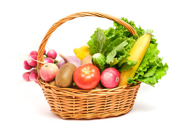 Fruits and vegetables in a wicker basket white background.