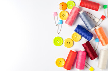 Accessories for sewing on a white background. Closeup. Copy space
