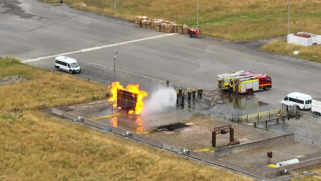 Firefighters Undergoing Training in a Mock Fire Response Emergency