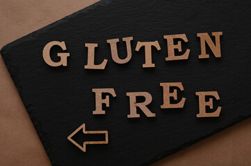 The letters Gluten free on a black background