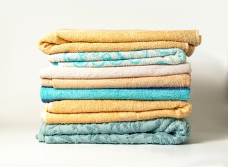 Different colors of towels isolated on white background