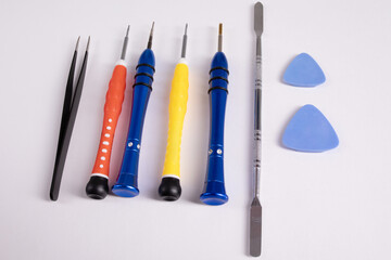 Mobile phone repair tools on a white background