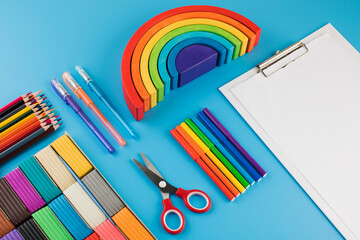  Stationery for creativity on a blue background. Back to school. Copy space.