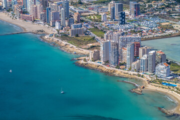 Fototapeta na wymiar view of the coast, beaches and sea of ​​the city of Calpe with its apartment buildings and hotels