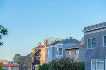 Row of houses with different exterior designs in the suburbs of San Francisco, CA