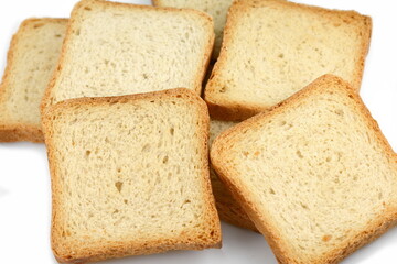 Fototapeta na wymiar Integral whole wheat toast bread slices isolated on white background. Pieces of toast bread isolated on white. Close-up