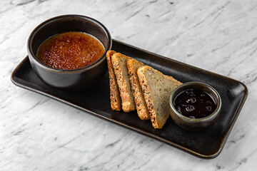 Duck liver pate with wild cherry jam and rye bread toast