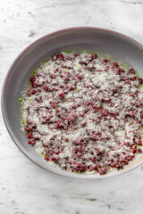 Carpaccio of finely chopped beef with cheese and spices