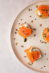 Smoked Salmon Cream Cheese on Crackers with Seeds 