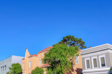 Fototapeta na wymiar Three houses in a row at San Francisco, California against the sky