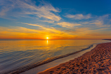 Fototapeta premium Beautiful summer sunset over beach at Baltic sea