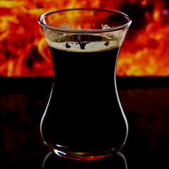 Turkish glass with coffee against the background of a flame