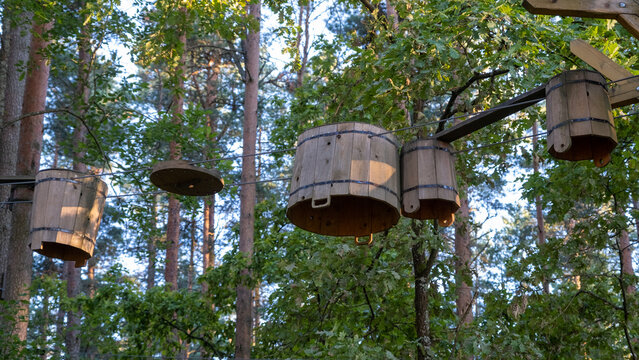 Rope adventure park in the summer forest. Abstract concept Overcoming obstacles and reaching heights