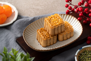 Delicious mung bean moon cake for Mid-Autumn Festival food mooncake on gray table background.