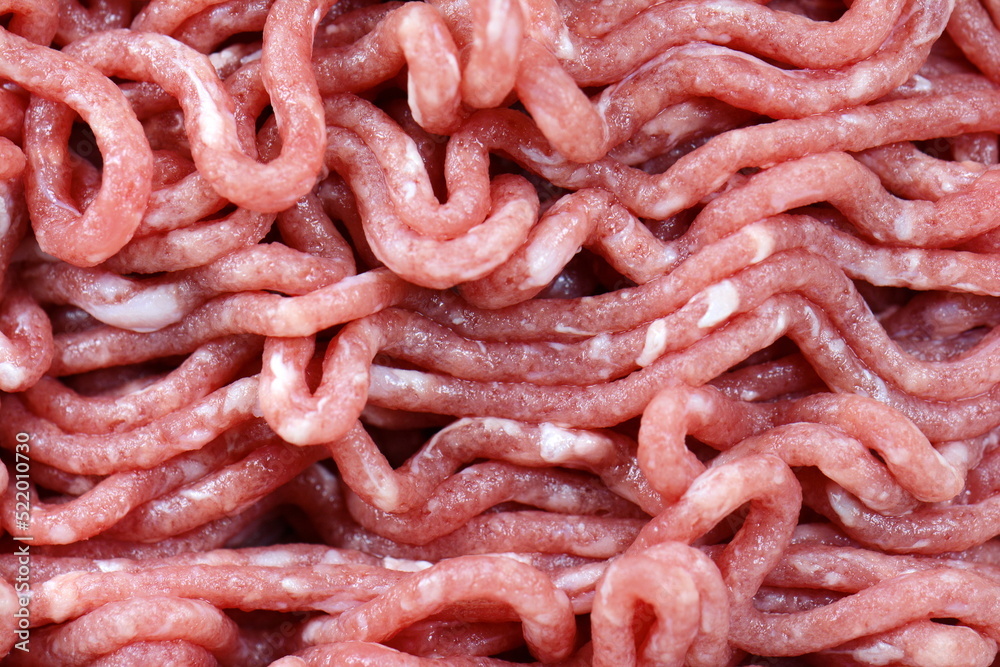 Wall mural macro, raw minced meat in close-up, texture background.