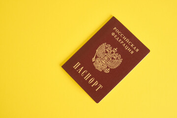 Russian passport on a yellow background copy space