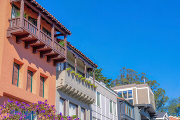 Low angle view of rowhouses with mediterranean and traditional designs in San Francisco, CA