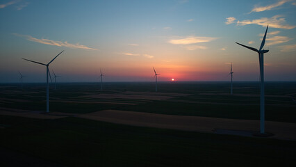 Windmill farm park and turbines for producing green electricity.