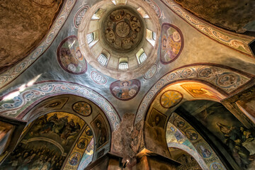 Interior of the St. Sophia Cathedral with mosaic, painting frescoes on the wall and the golden altar. Kyiv, Ukraine