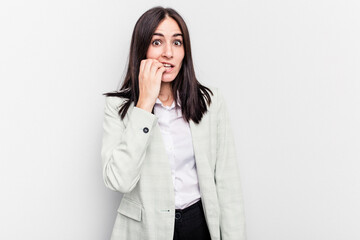 Young business caucasian woman isolated on white background biting fingernails, nervous and very anxious.