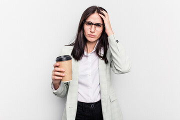 Young business caucasian woman holding takeaway coffee isolated on white background being shocked, she has remembered important meeting.