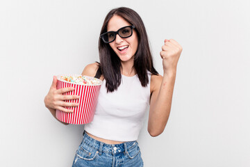 Young caucasian woman eating popcorn isolated on white background