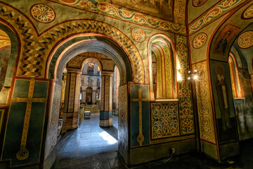 Fototapeta na wymiar Interior of the St. Sophia Cathedral with mosaic, painting frescoes on the wall and the golden altar. Kyiv, Ukraine