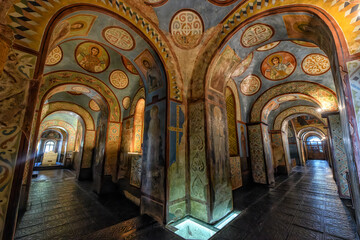 Obraz premium Interior of the St. Sophia Cathedral with mosaic, painting frescoes on the wall and the golden altar. Kyiv, Ukraine