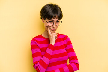 Young caucasian woman with a short hair cut isolated contemplating, planning a strategy, thinking about the way of a business.