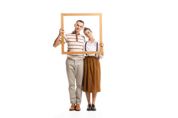 Obraz na płótnie Canvas Portrait of man and woman posing together in a picture frame isolated white on background. Retro style. Family look