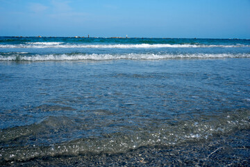 on the beach with a view of the sea