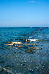 rocks that rise out of the sea at low tide