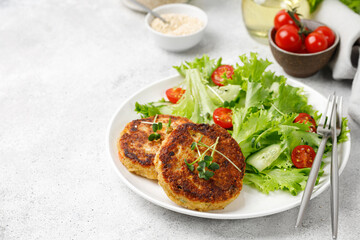 Vegan Cutlets with Quinoa served with lettuce, tomatoes, microgreens. Diet concept, Vegan food plate.