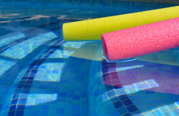 Swim noodles in swimming pool