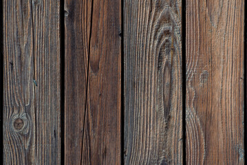 Brown natural wood dark background, vintage, with knots and nail holes, wood planks, old