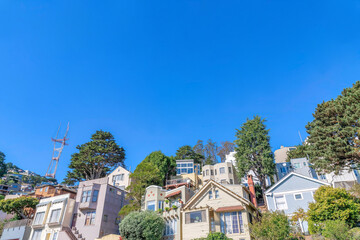Fototapeta na wymiar Slope with dense houses near the Sutro Tower in San Francisco, California