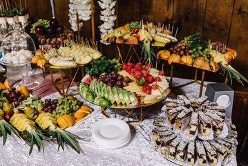 Fresh fruit on skewers. Concept buffet for a summer party. Fruits on sticks.