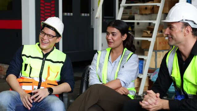 Group warehouse worker people discussion talking together at warehouse factory workplace. Relax. Professional engineering teamwork.
