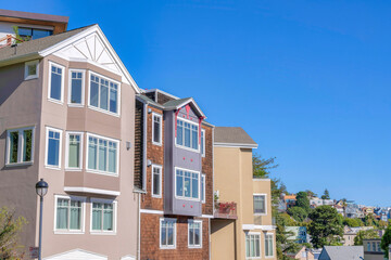 Row of four-storey houses with brown color scheme exterior at San Francisco, California
