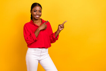 Photo of young pretty lady promoter indicate fingers empty space select direct banner isolated over...