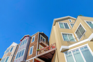 Low angle view of houses with corner balconies in San Francisco, CA