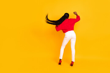 Full body back rear view photo of young excited woman dance hang-out clubber isolated over yellow color background