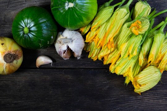trunk zucchini and flowers on rustic wood
