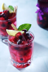 Cold refreshing drink with fresh berry and ice