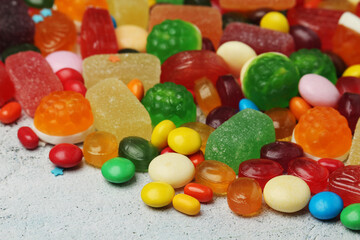 Bright candy lollies on white background