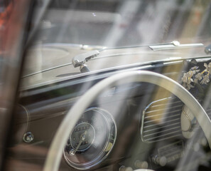 Dashboard and steering wheel of old-timer car