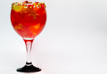 Fruit jelly cocktail. Glass cup filled with strawberry jelly and rims of stars with sugar. Gelatin mix. Sugary drinks. Cool drinks.
